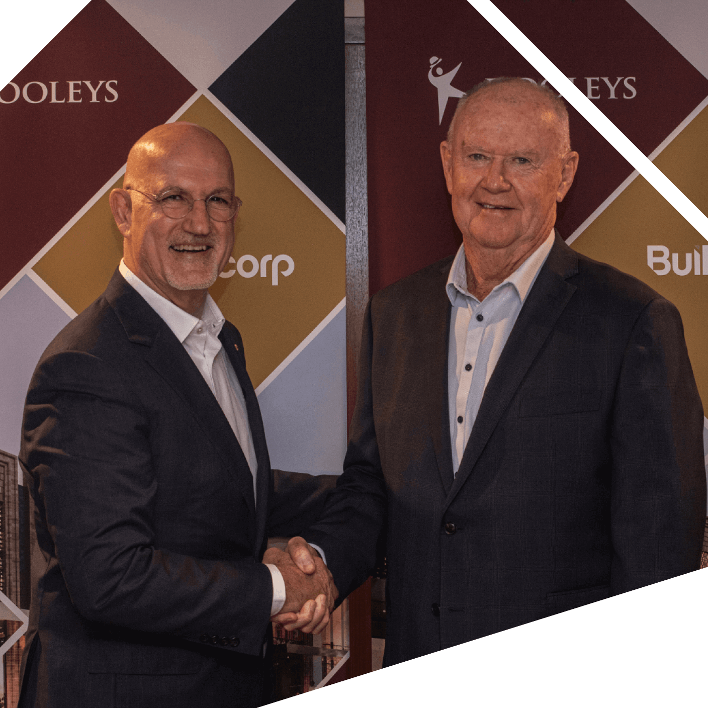 Two men shaking hands at DOOLEYS